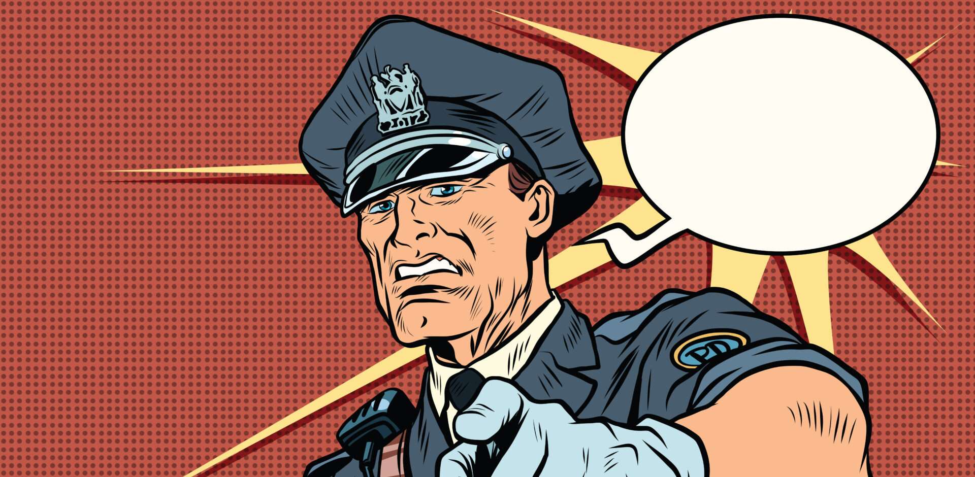 警察官が英語の吹き出しを指さしている。