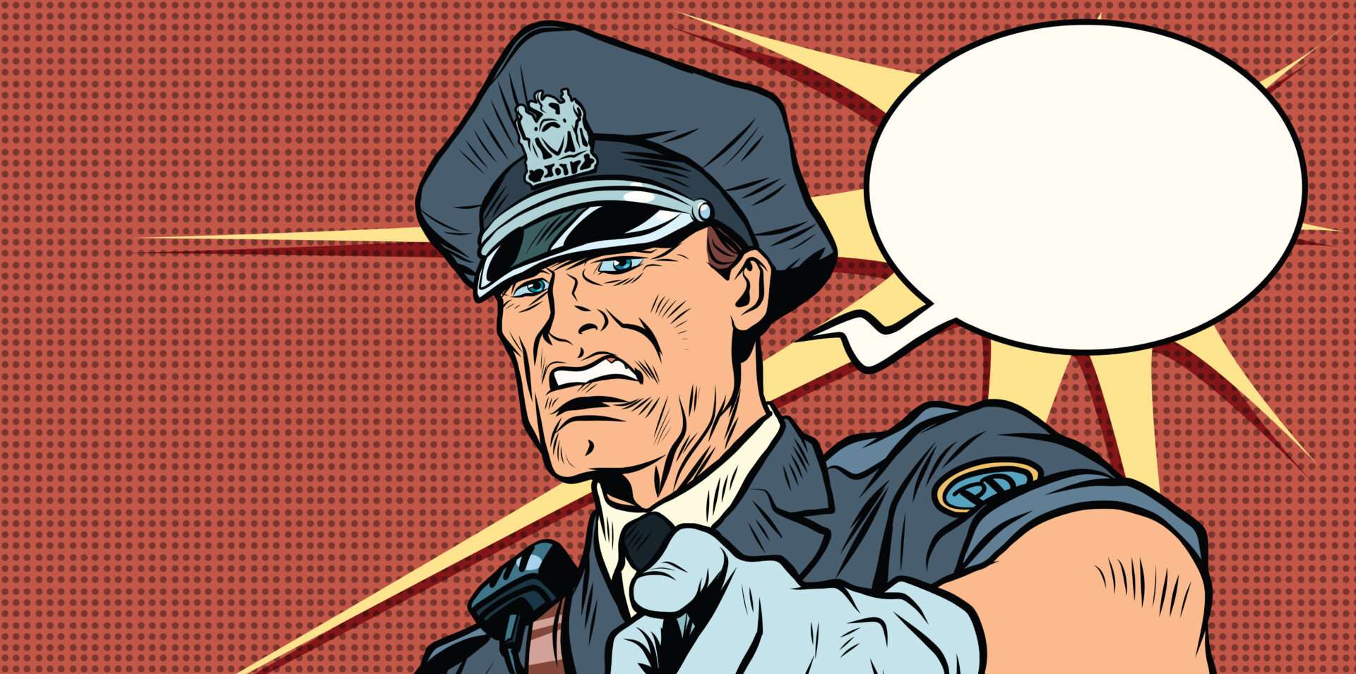 英語の吹き出しを指差す警察官。