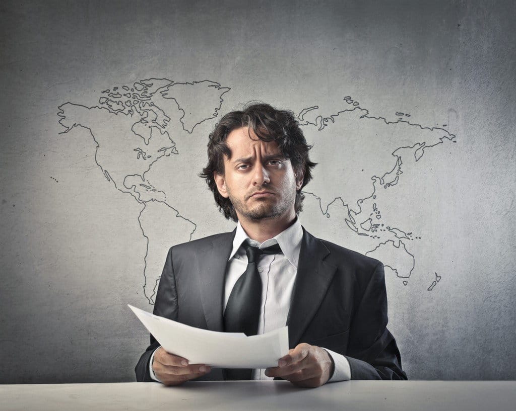 説明： 一人の商人がスコスコの前に座り、スコスコの上には世界地図が表示されています。
关键词：英語