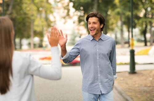 Opposite-sex,Friendship.,Man,Waving,Hello,Gesture,Meeting,Female,Friend,Walking